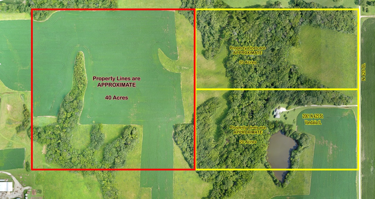 Aerial drone photo of farmland with property lines and subdivision layout.